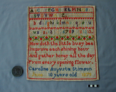 Embroidery sampler and medal Sampler and Great Exhibition Bronze medallion
